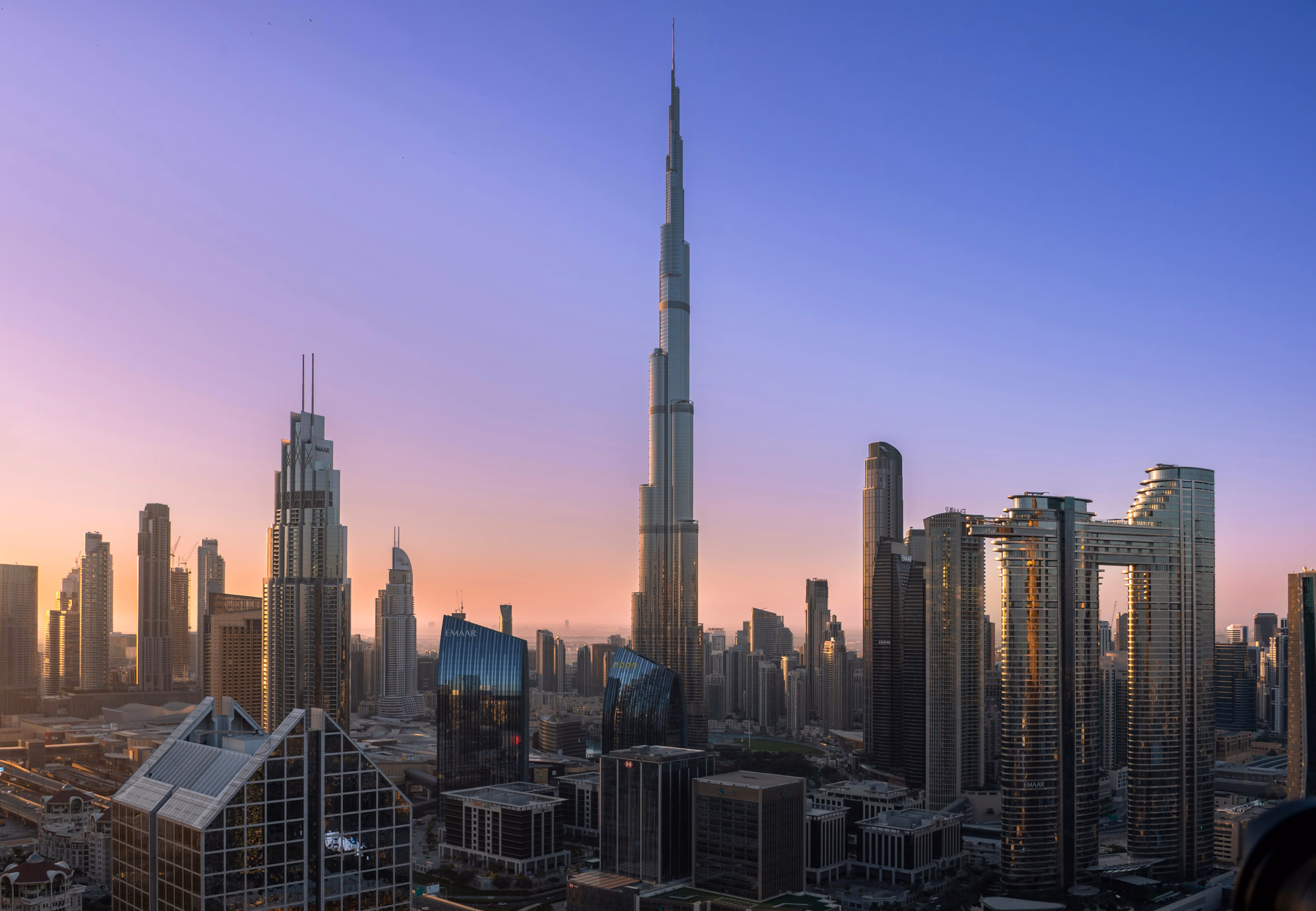 Dubai skyline at sunset with Burj Khalifa in the center