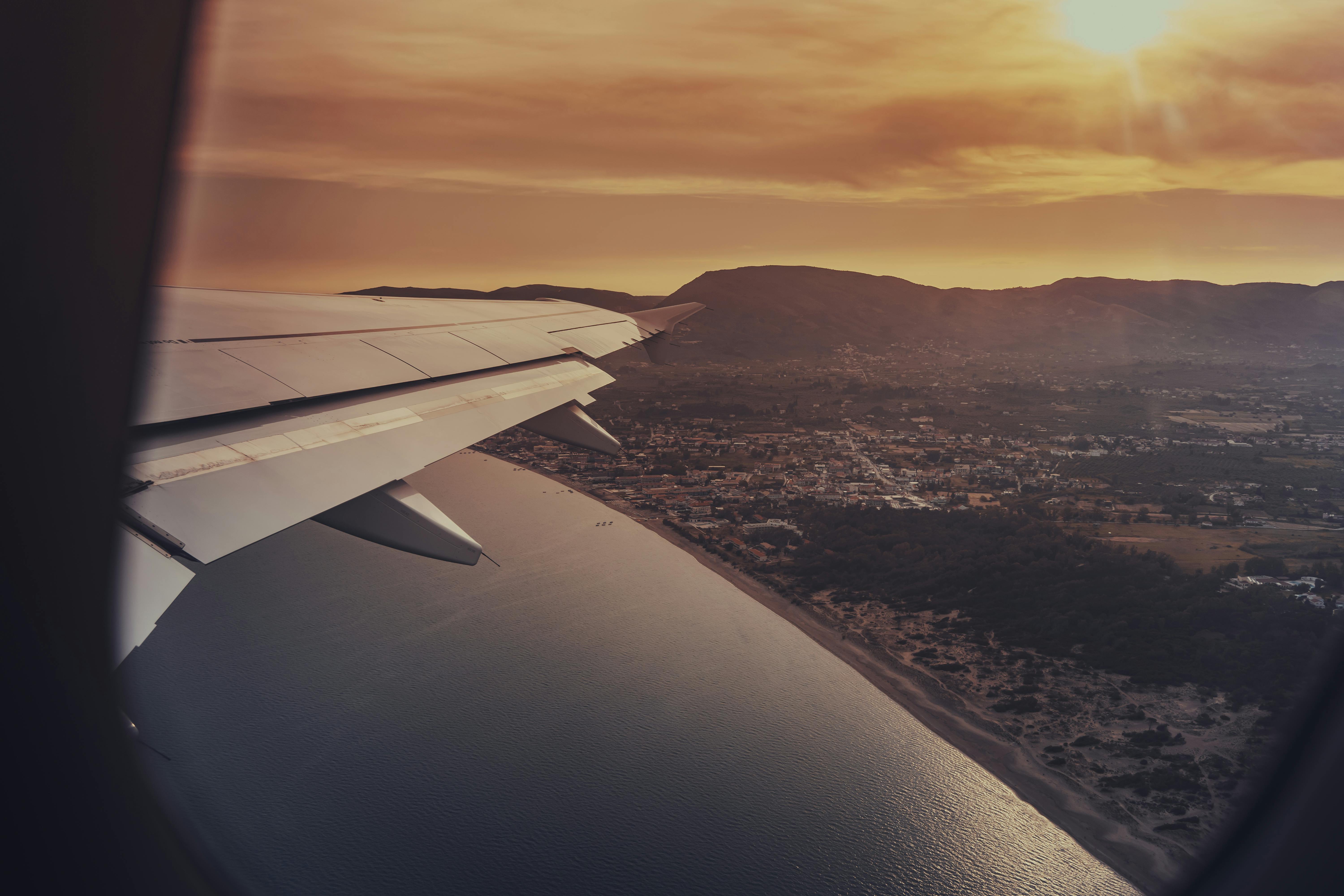 View from an airplane window at sunset